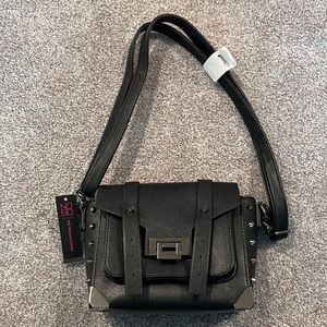 Smaller in size brand new No Boundries purse